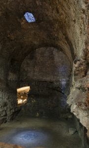 A dark stone cove inside a castle