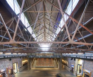 The Engine Shed, Stirling, an interior shot showing metal roof structure and a large map of Scotland
