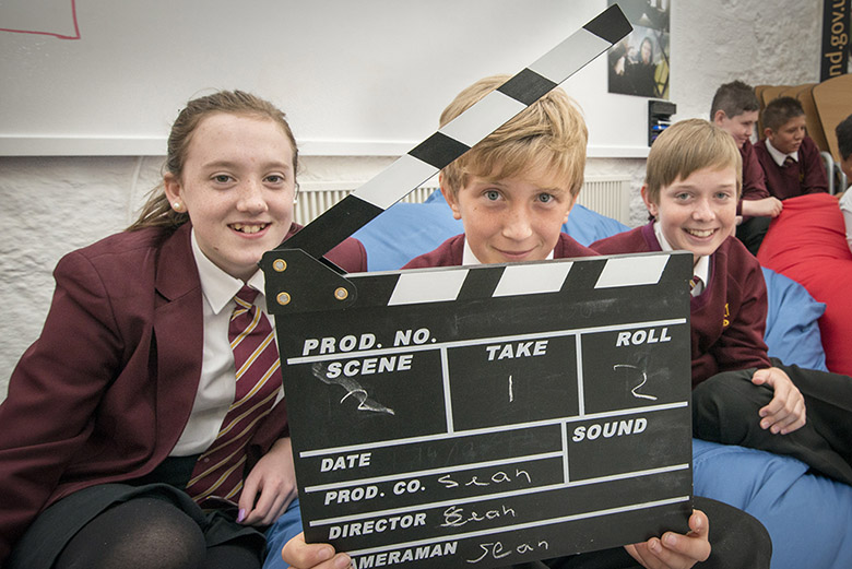 School pupils from St Modan's High School hold up a clapperboard