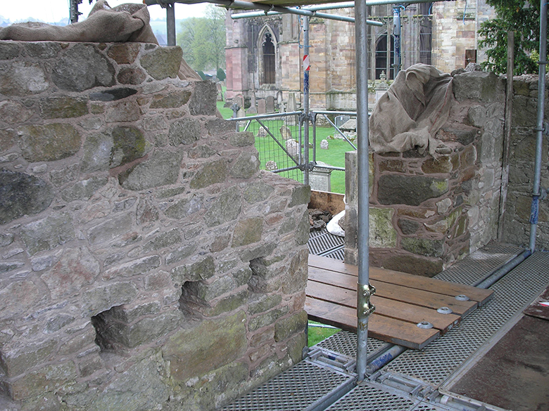 The yard wall at Melrose Abbey brewery in 2011 before repairs began