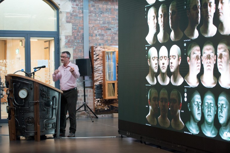 A person giving a talk at the Engine Shed