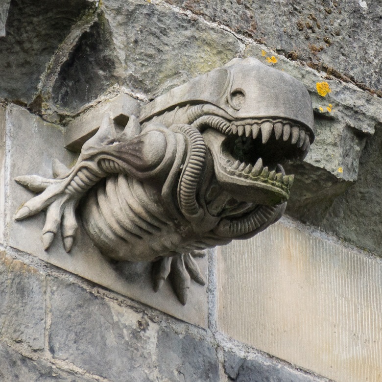 A grotesque. stone alien gargoyle