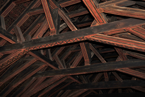 Wooden beams painted red with black designs