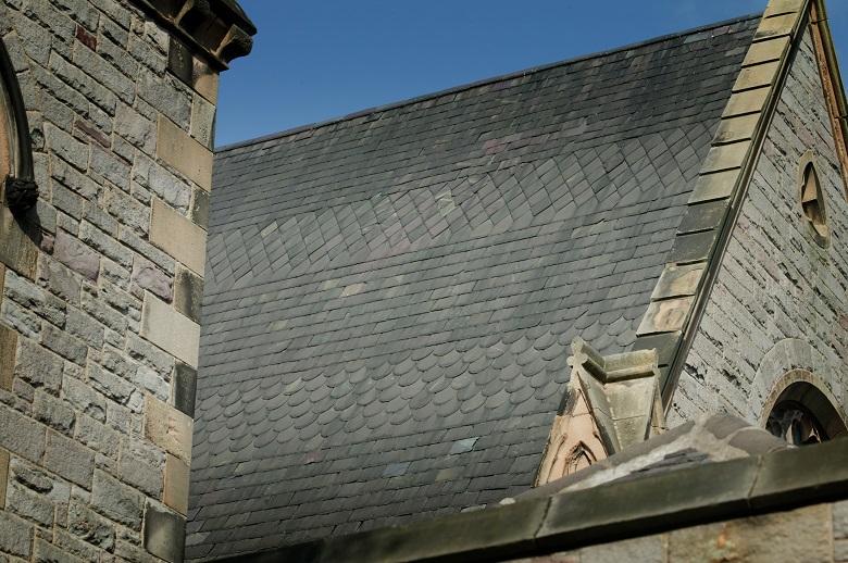 A slate roof on a historic stone church