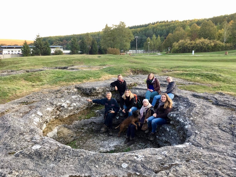 A group of people at a historic stone site