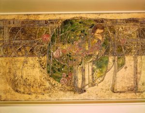 An artwork featuring roses, a woman and other designs