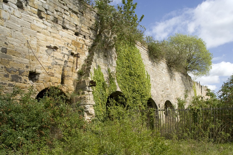 A large, stone lime kiln