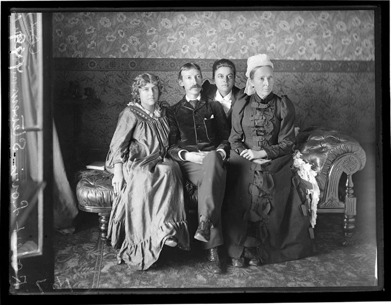 Four people sitting on a chaise longue