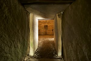 A narrow passageway into a burial cairn