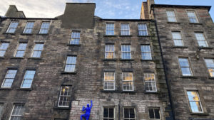 A mutiple storey, stone tenement building
