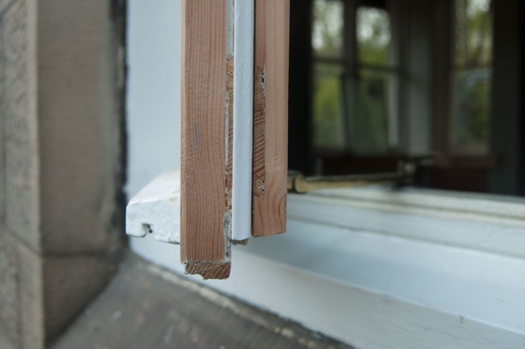 A draft strip on a sash and case window is one easy way to save energy in an older home
