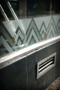 A zig zag pattern etched into a glass shopfront