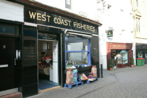 A black, glossy historic shopfront