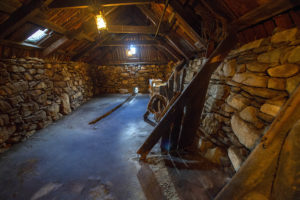 Inside Arnol Blackhouse, which has walls built from stone held together with earth mortar