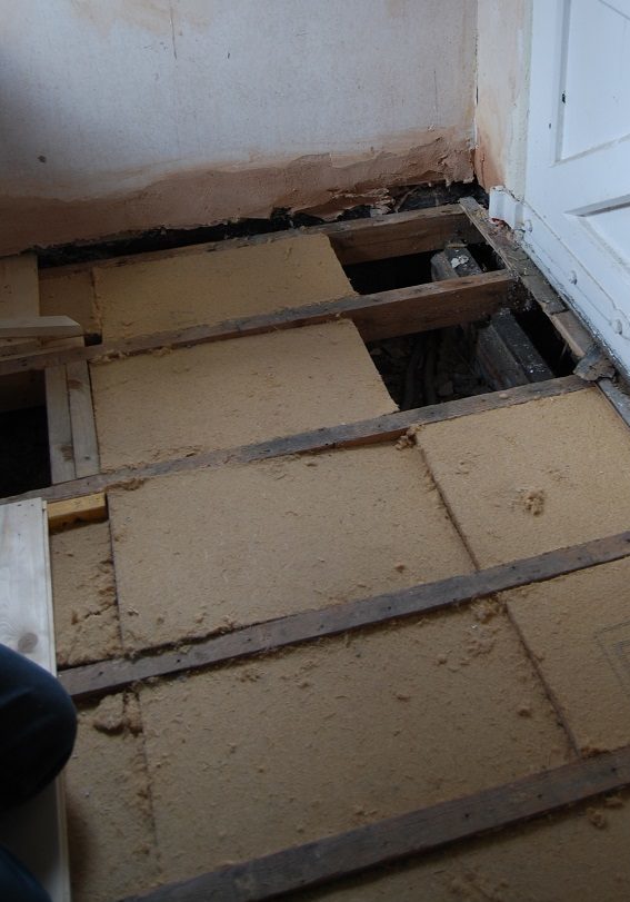 A floor in an older home covered with insulation