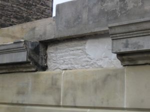 A missing piece of stone in a historic stone building