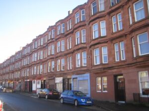 A row of traditional red sandstone tenements in the city