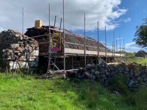 Scaffolding up at a historic thatched building in the countryside