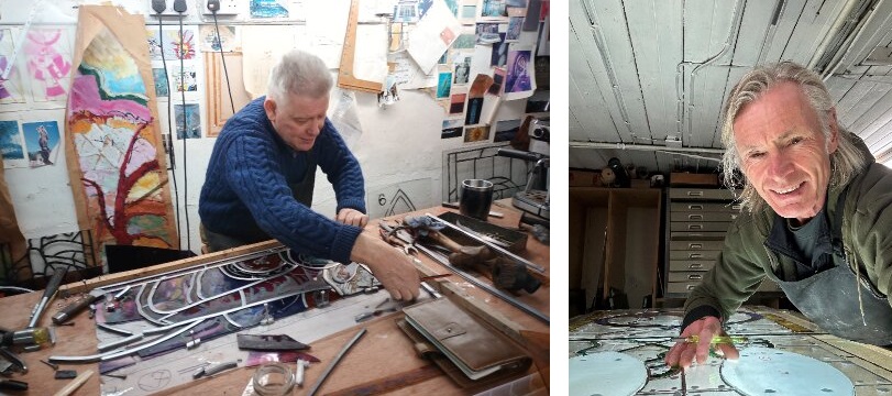 Two photos of people working in stained glass studios. In the first, the person is measuring out a window and in the second the person is looking at the camera and smiling as they work on an illustration.