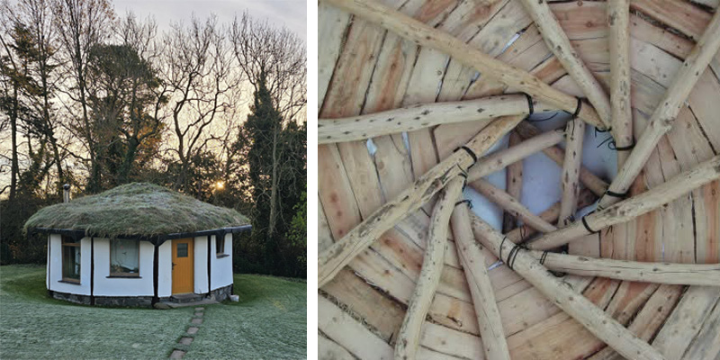 A traditional round house with a yellow door and a thatched roof. The inside of the roof is made from timber planks and round lengths of wood.