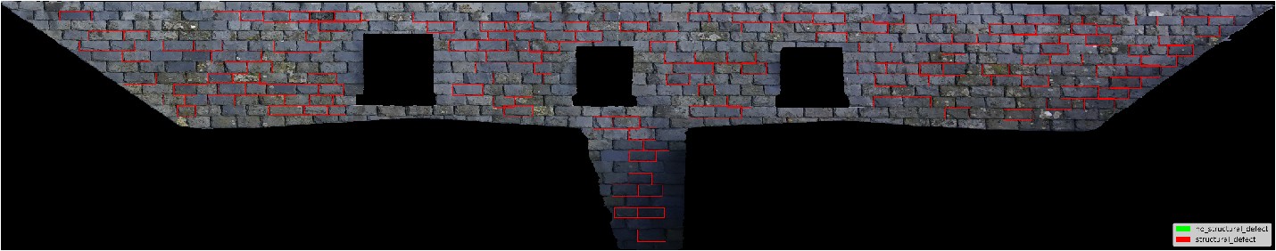 A digital image of a roof where many slates are marked out with red lines to show various defects.